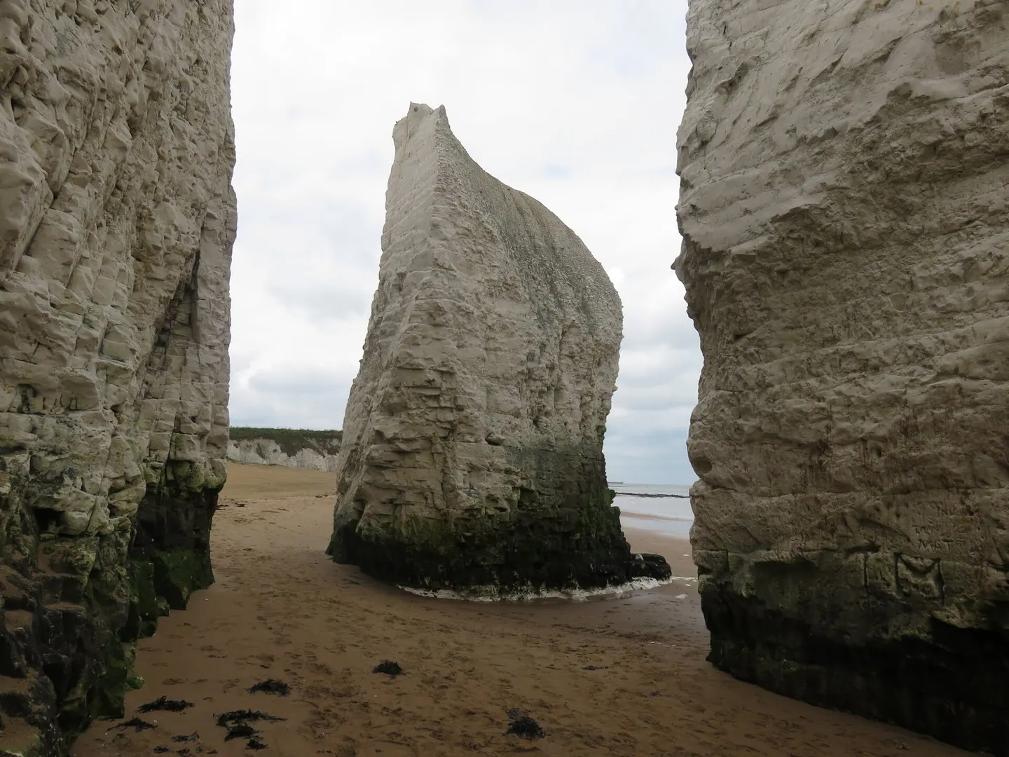 White chalk cliffs and a chalk stack on the sand at Botany Bay in Kent
