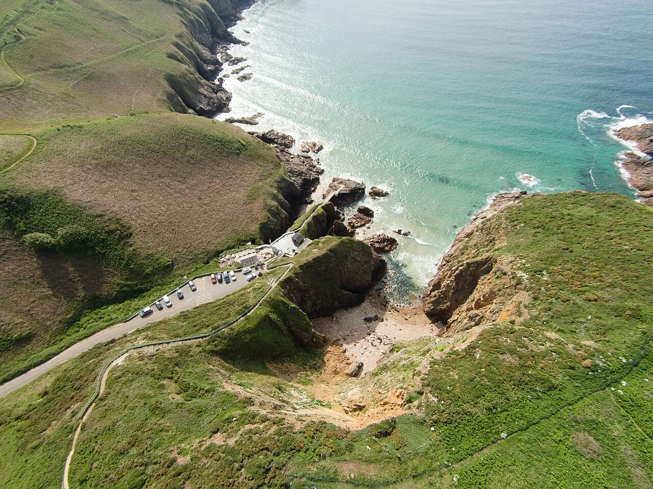 Aerial view of the cliffs, beach and approach at Plémont.
