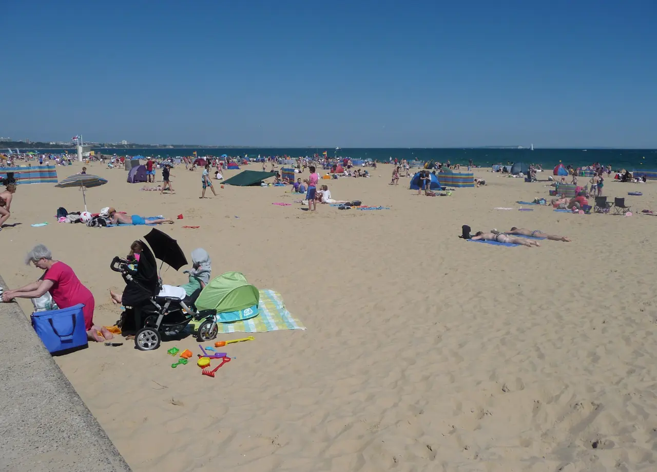 A nice sandy beach for all the people to come and enjoy on days like this.