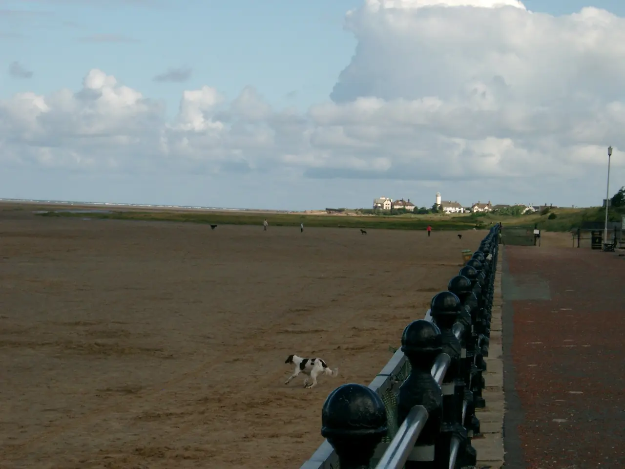 The beach at West Kirby, Wirral, UK, looking towards the northwestern corner of the Wirral peninsula across the Royal Liverpool golf course on the right.
