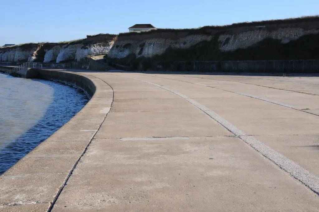 A curving cliff-base promenade along the coast at Grenham Bay