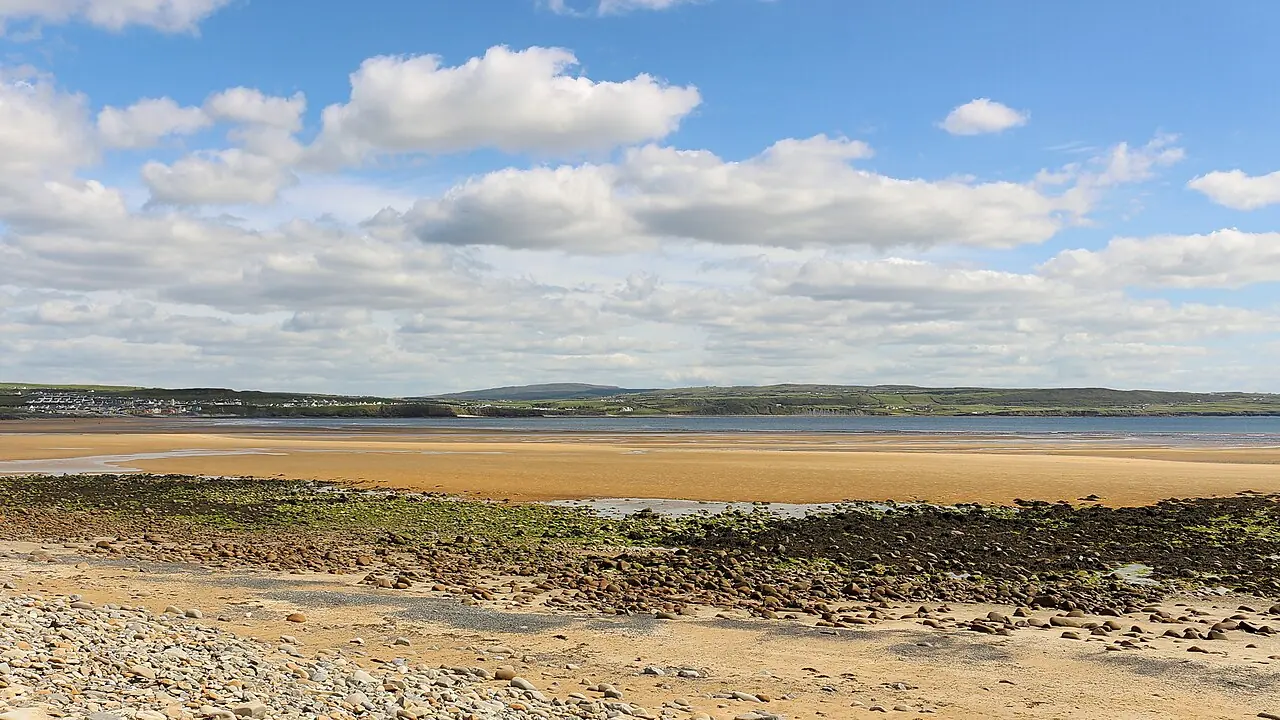 The broad tidal shore at Lahinch beside Liscannor Bay.
