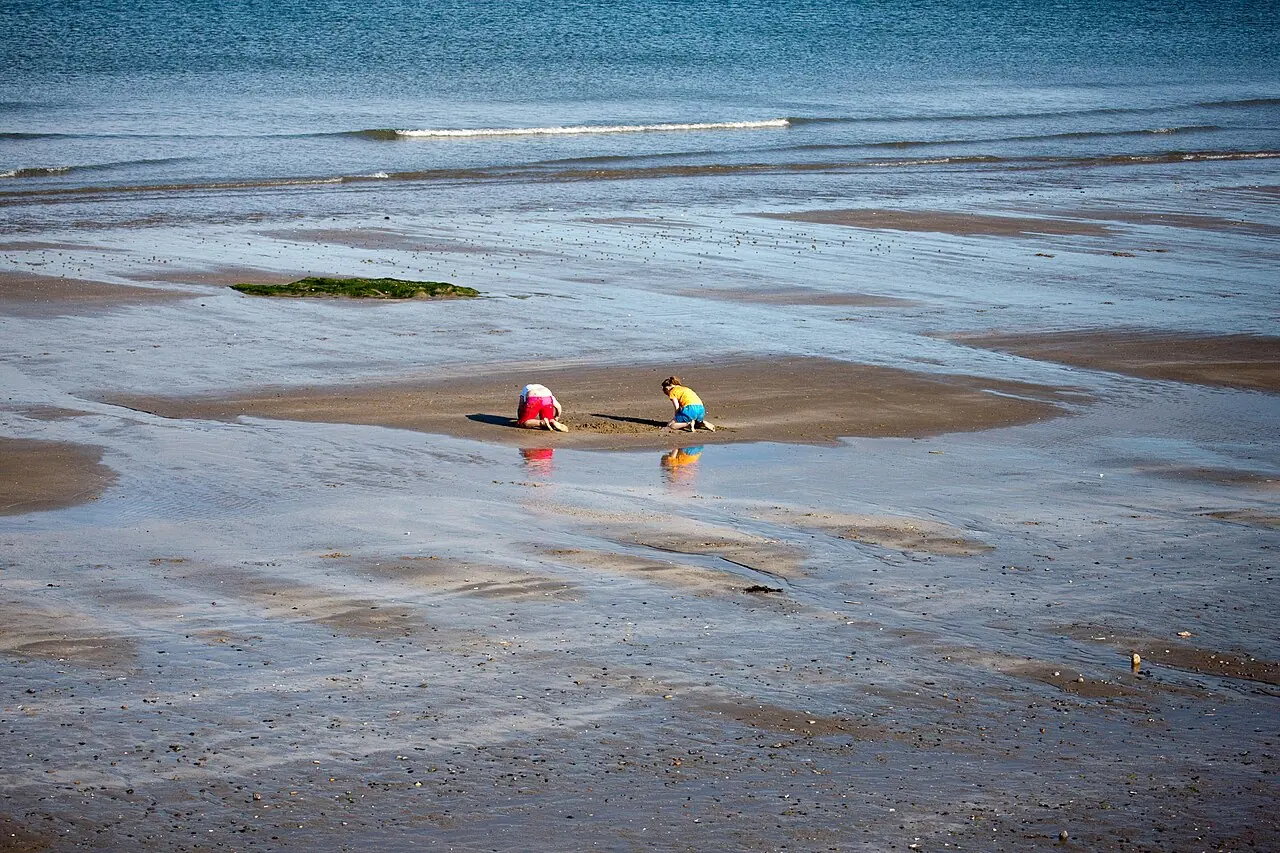 Shallow water and wet sand on Velvet Strand at Portmarnock.