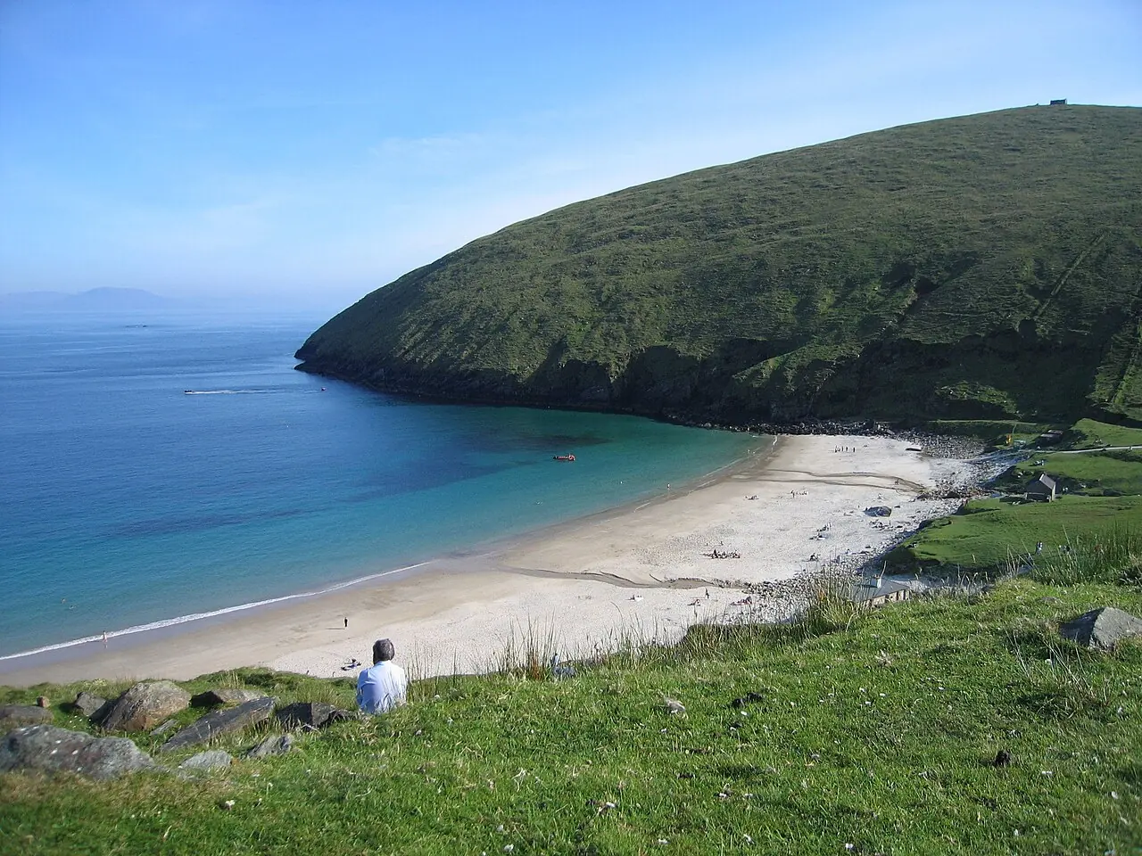 Keem’s sandy horseshoe bay beneath a steep green hillside.