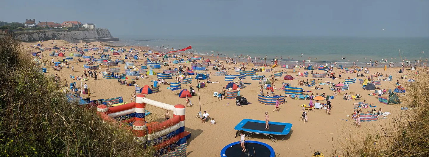 The sandy beach at Joss Bay on a busy summer day