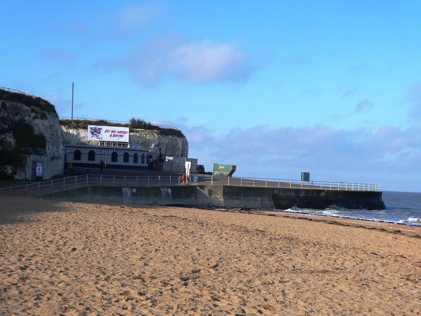 Sand and the cliff-backed shore at Palm Bay in Margate